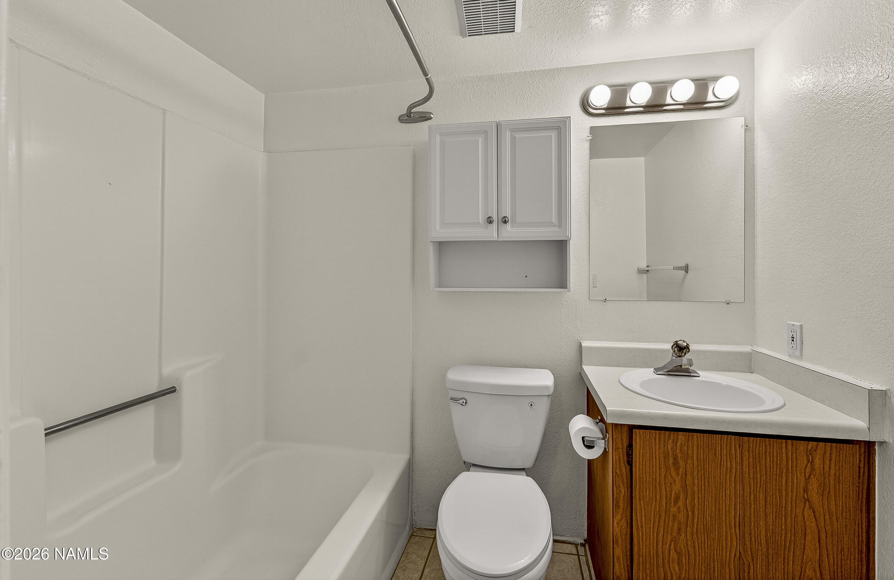 1200 South Riordan Ranch Street, Unit 112 Flagstaff, AZ 86001 - Photo 16 of 22 a bathroom with a sink toilet and shower