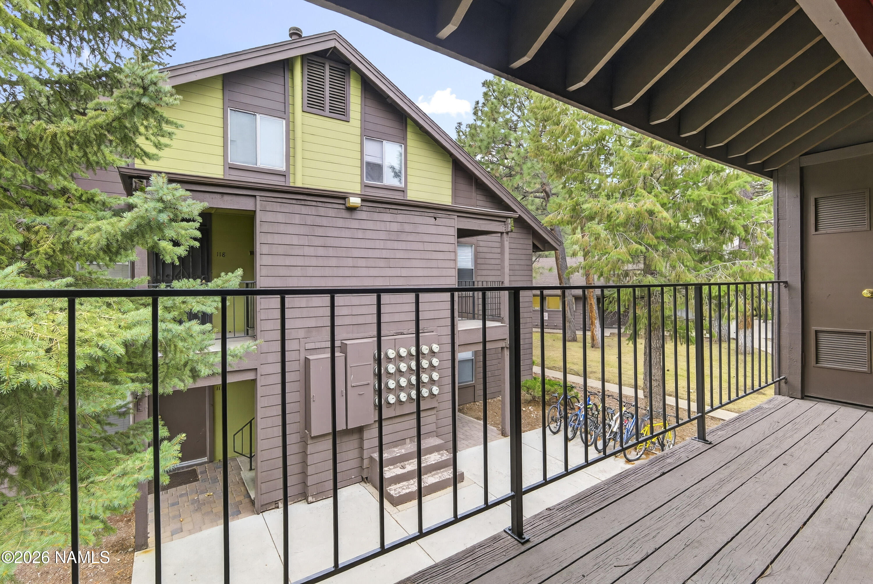 1200 South Riordan Ranch Street, Unit 112 Flagstaff, AZ 86001 - Photo 18 of 22 a view of a house with wooden deck and floor