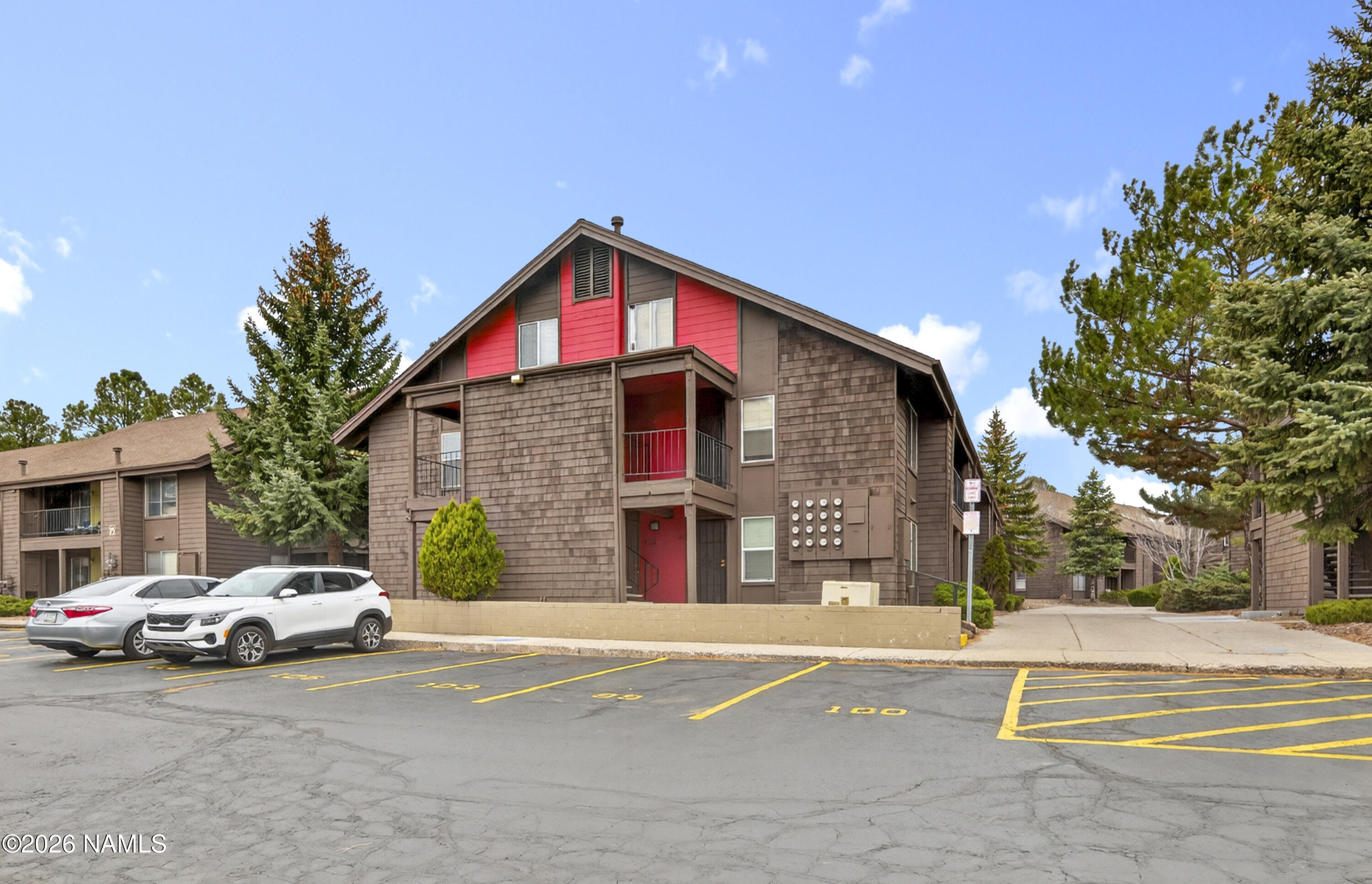 1200 South Riordan Ranch Street, Unit 112 Flagstaff, AZ 86001 - Photo 2 of 22 a front view of a house with a yard