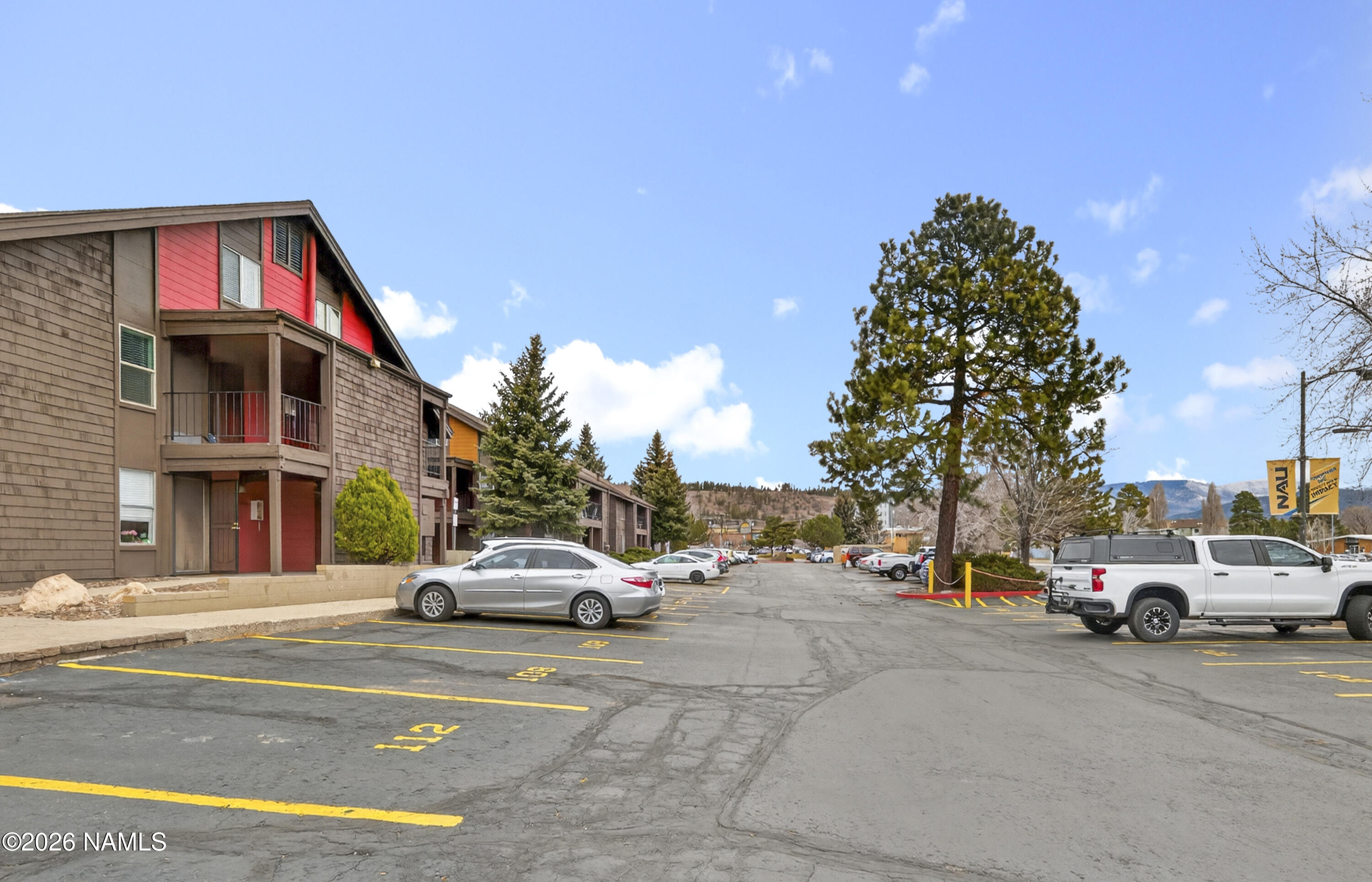 1200 South Riordan Ranch Street, Unit 112 Flagstaff, AZ 86001 - Photo 21 of 22 a view of road with card parked on side and retail shops