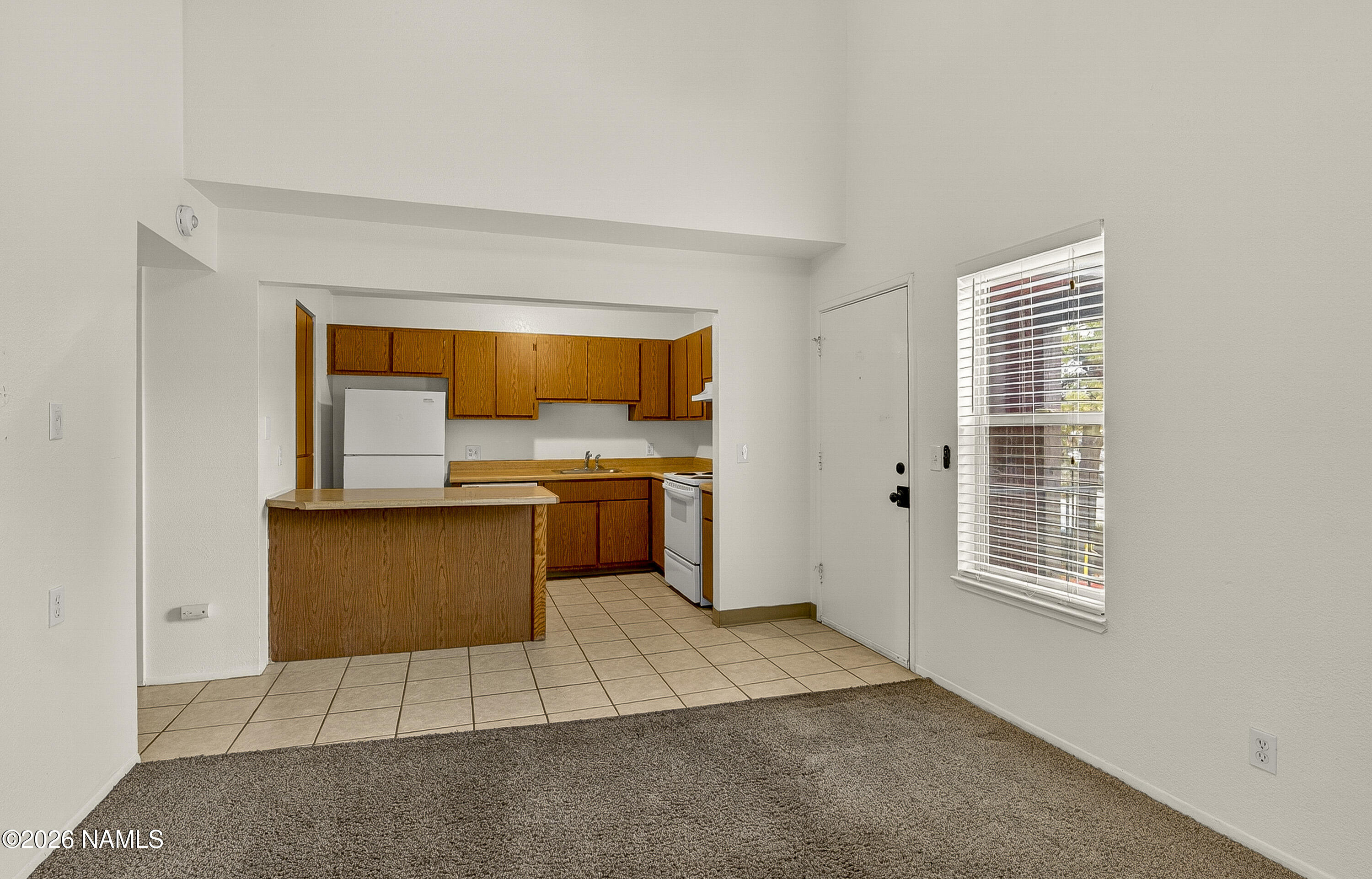 1200 South Riordan Ranch Street, Unit 112 Flagstaff, AZ 86001 - Photo 5 of 22 a kitchen with a sink a counter top space and appliances