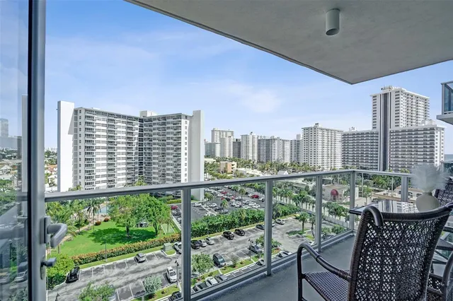 a view of a balcony with an outdoor seating