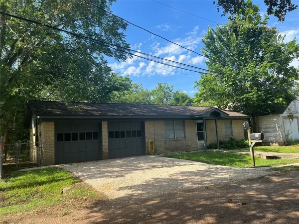 a house view with a garden space