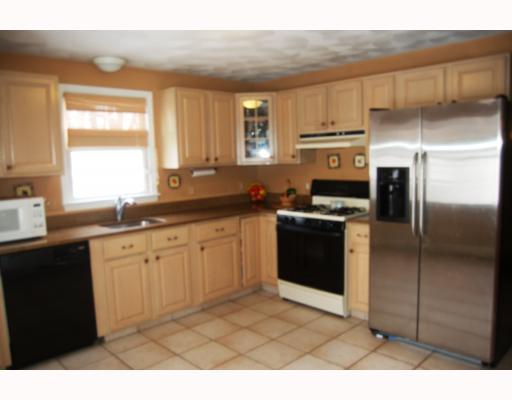 169 Lonsdale Farm Road Cumberland, RI 02864 - Photo 3 of 12 Kitchen. Full functional tiled kitchen accented by stainless steel and quartz counters, plenty of storage.