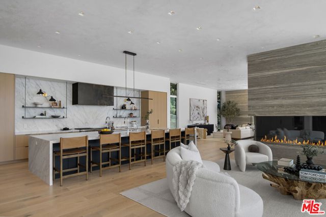 a kitchen with stainless steel appliances a stove and a refrigerator
