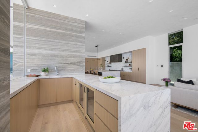 a large white bed sitting in a middle of a yard