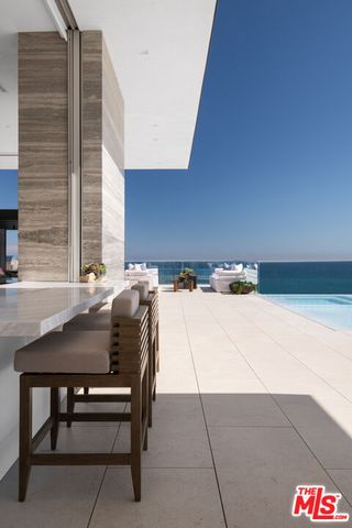 a bathroom with a double vanity sink and mirror