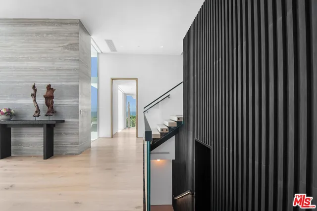 a bathroom with a sink mirror and a bath tub