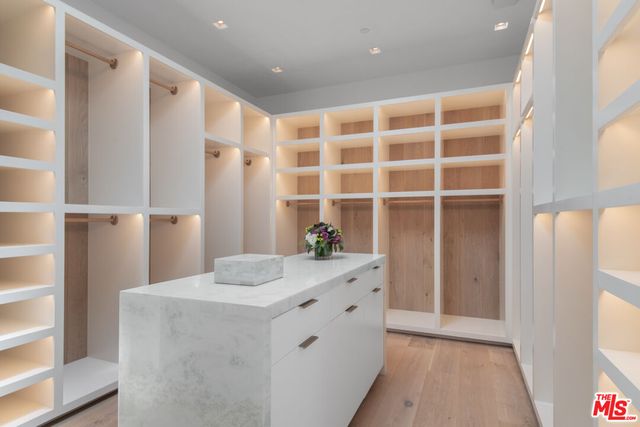 a view of a patio with table and chairs and potted plants