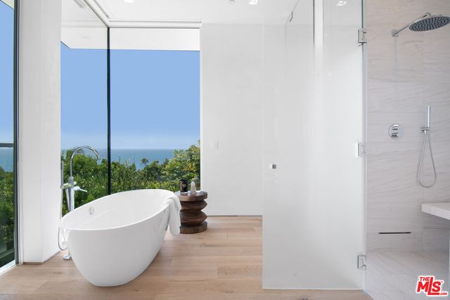 a dinning table sitting in a kitchen next to a window