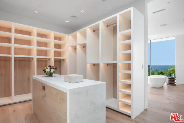 a view of a patio with couches and potted plants
