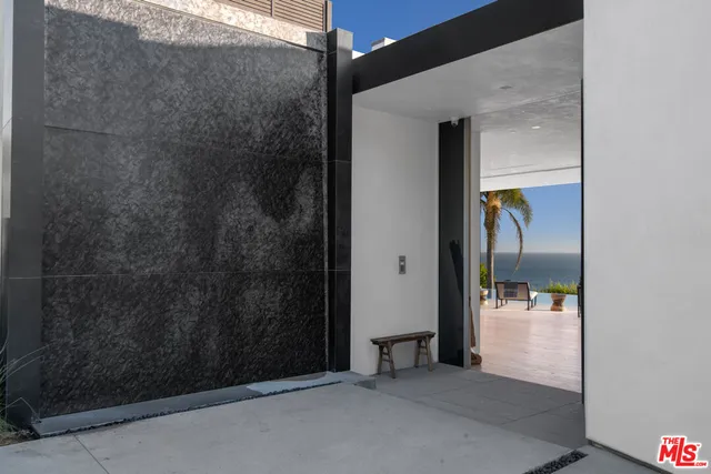 a view of kitchen with furniture and wooden floor