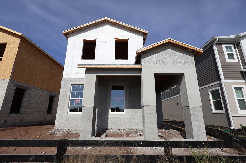 5276 Ctr Lk Rnch Boulevard St. Cloud, FL 34771 - Photo 1 of 30 a front view of a house with glass windows