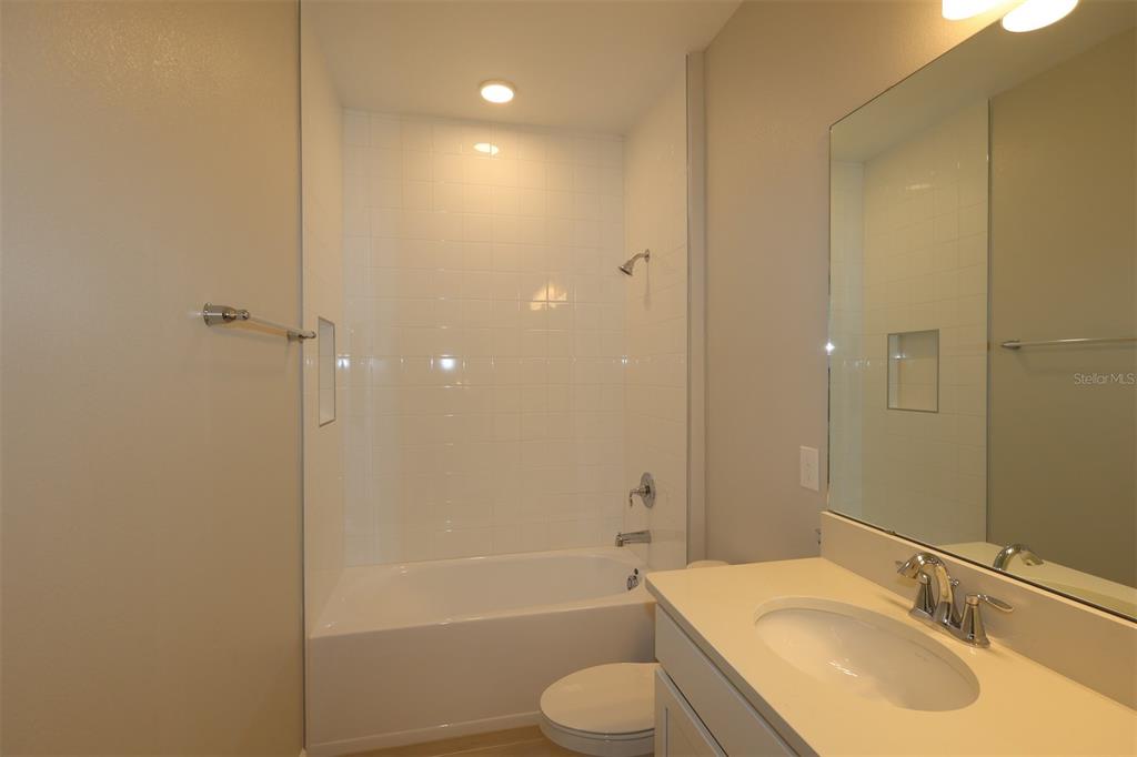 5276 Ctr Lk Rnch Boulevard St. Cloud, FL 34771 - Photo 12 of 23 a bathroom with a sink toilet and shower