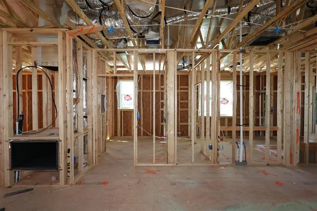 a view of a room with lots of wooden furniture
