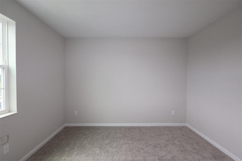 5276 Ctr Lk Rnch Boulevard St. Cloud, FL 34771 - Photo 13 of 23 an empty room with a window