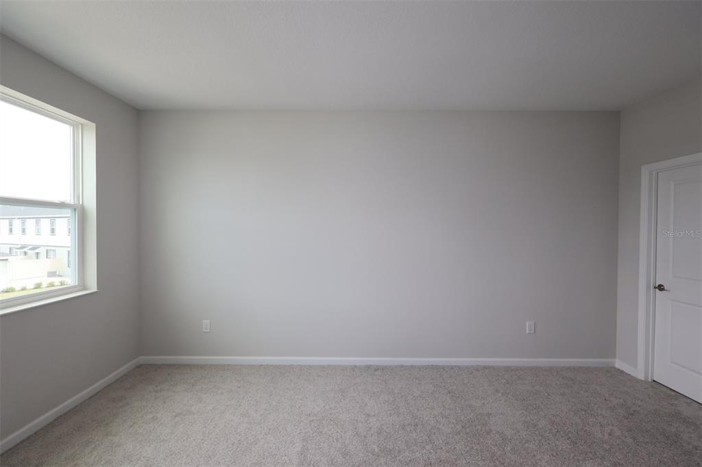 5276 Ctr Lk Rnch Boulevard St. Cloud, FL 34771 - Photo 16 of 23 an empty room with windows