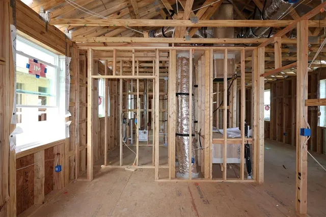 a view of an empty room with a staircase