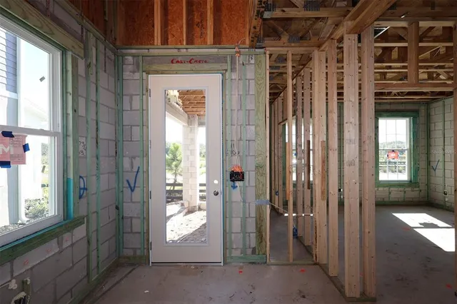 a view of an empty room with wooden walls