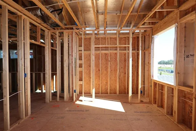 a view of an empty room with wooden walls