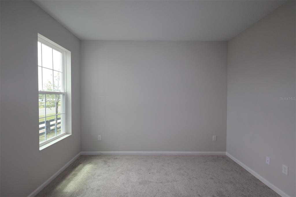 5276 Ctr Lk Rnch Boulevard St. Cloud, FL 34771 - Photo 9 of 23 an empty room with a window