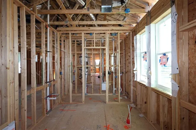 a view of an empty room with wooden walls