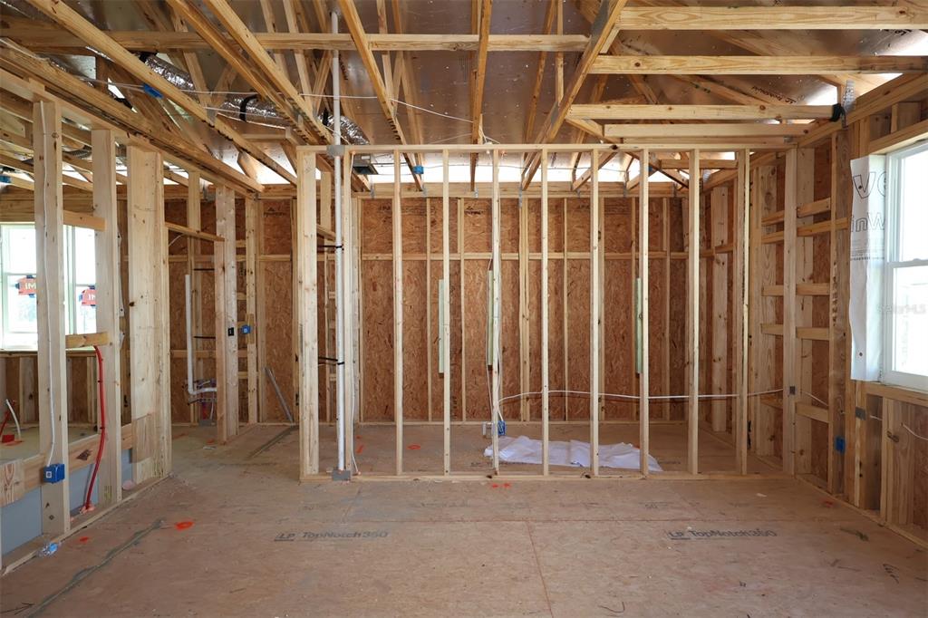 5276 Ctr Lk Rnch Boulevard St. Cloud, FL 34771 - Photo 10 of 30 a view of an empty room with wooden walls