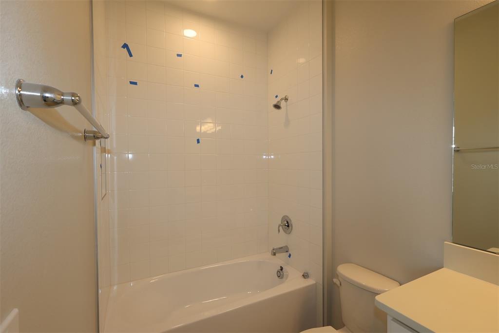5276 Ctr Lk Rnch Boulevard St. Cloud, FL 34771 - Photo 10 of 23 a bathroom with a bathtub and a toilet
