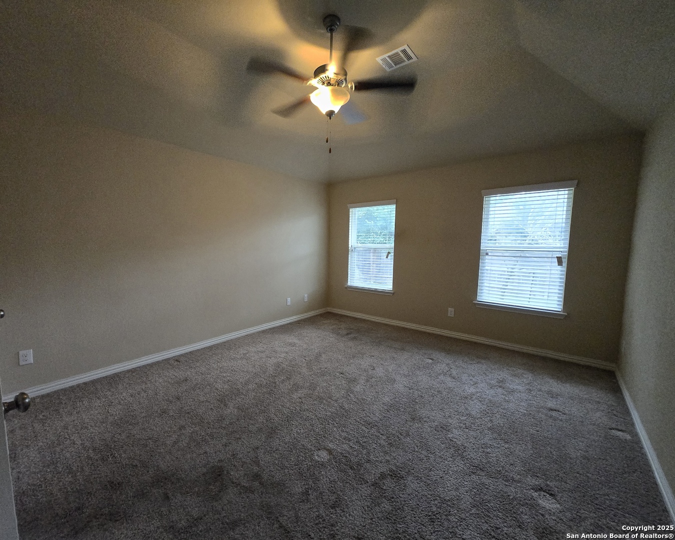 11518 Hanson's Forest Schertz, TX 78154 - Photo 11 of 26 an empty room with a window and a ceiling fan