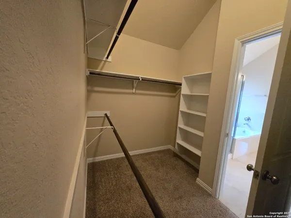a view of an empty walk in closet
