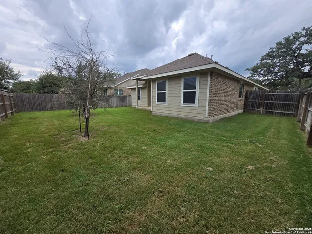 a house with a tree in front of it