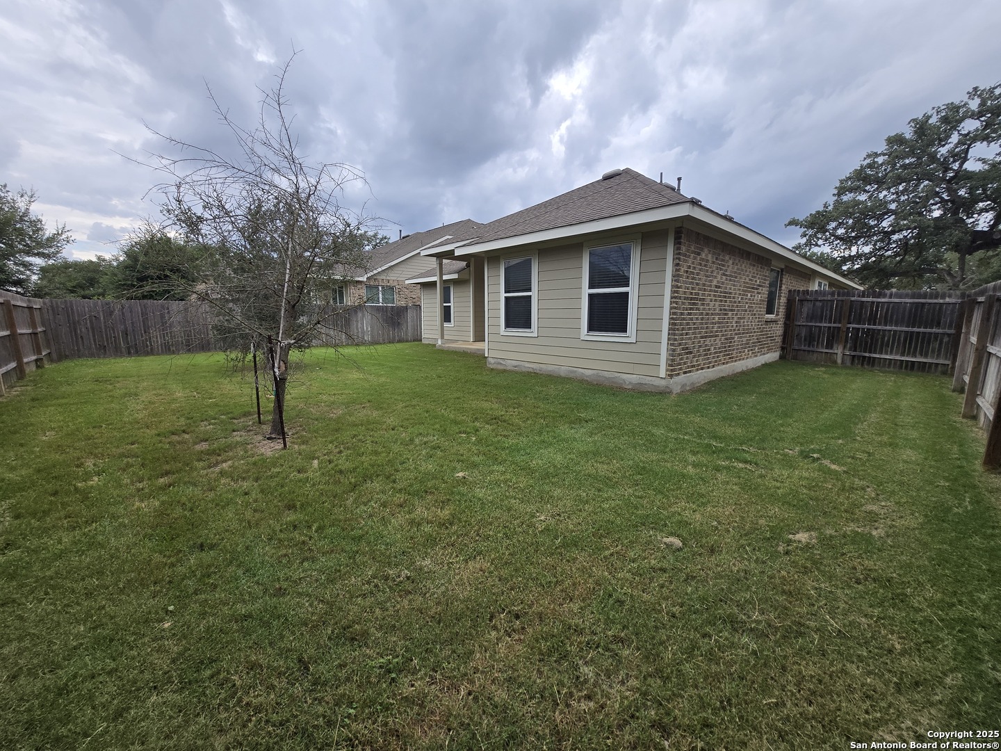 11518 Hanson's Forest Schertz, TX 78154 - Photo 25 of 26 a view of a house with a yard