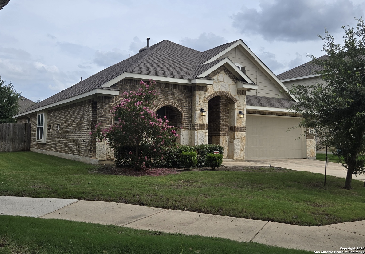 11518 Hanson's Forest Schertz, TX 78154 - Photo 3 of 26 a front view of a house with a yard and garage