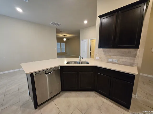 a kitchen with a sink and a microwave