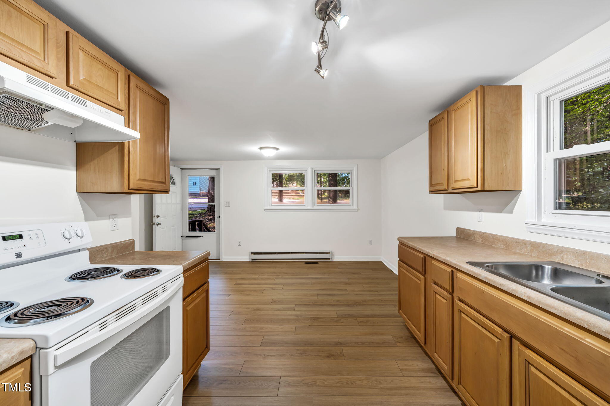 5500 Bobbitt Road Apex, NC 27539 - Photo 10 of 23 a kitchen with a stove and a sink