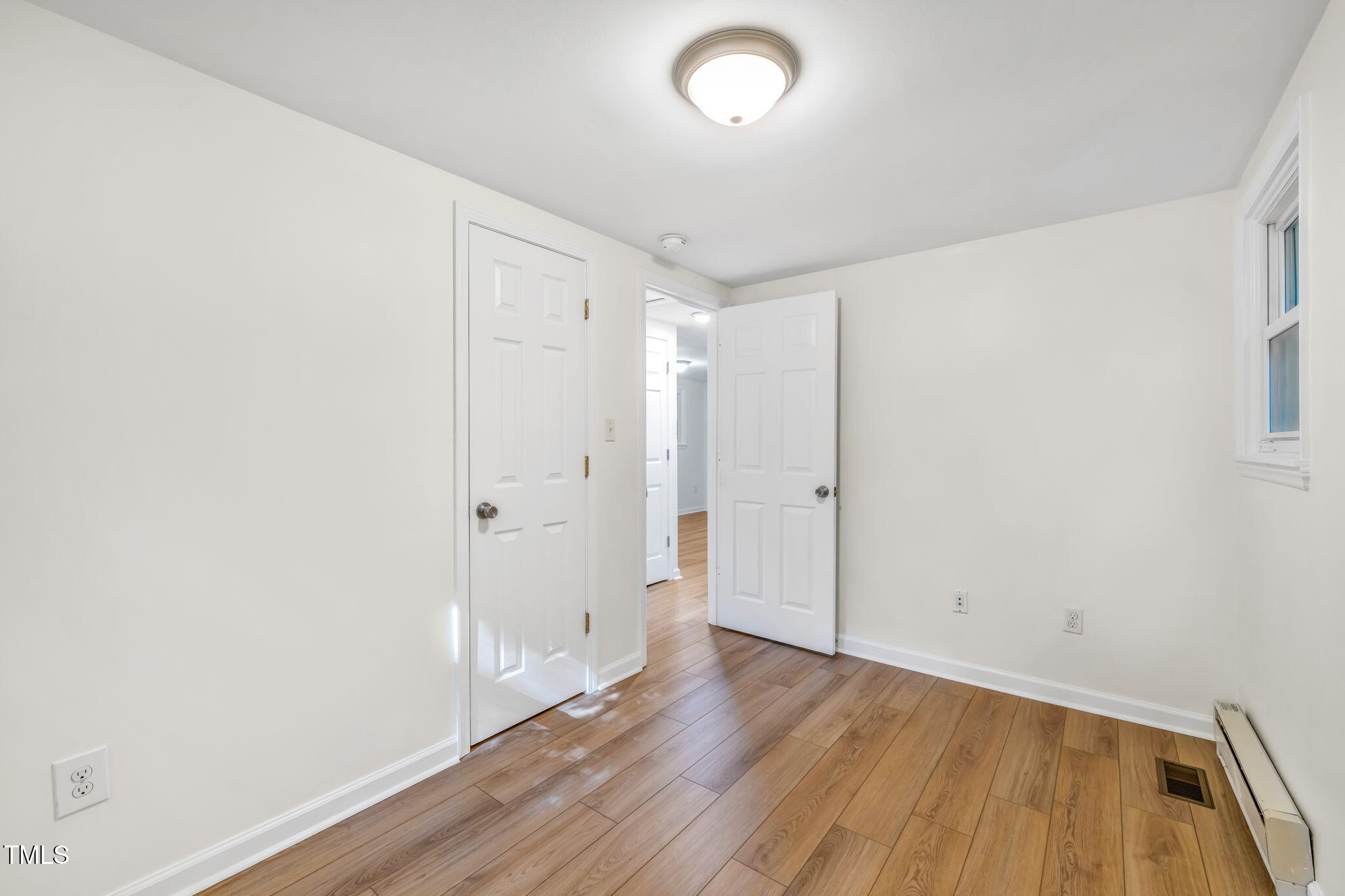 5500 Bobbitt Road Apex, NC 27539 - Photo 15 of 23 a view of a room with wooden floor
