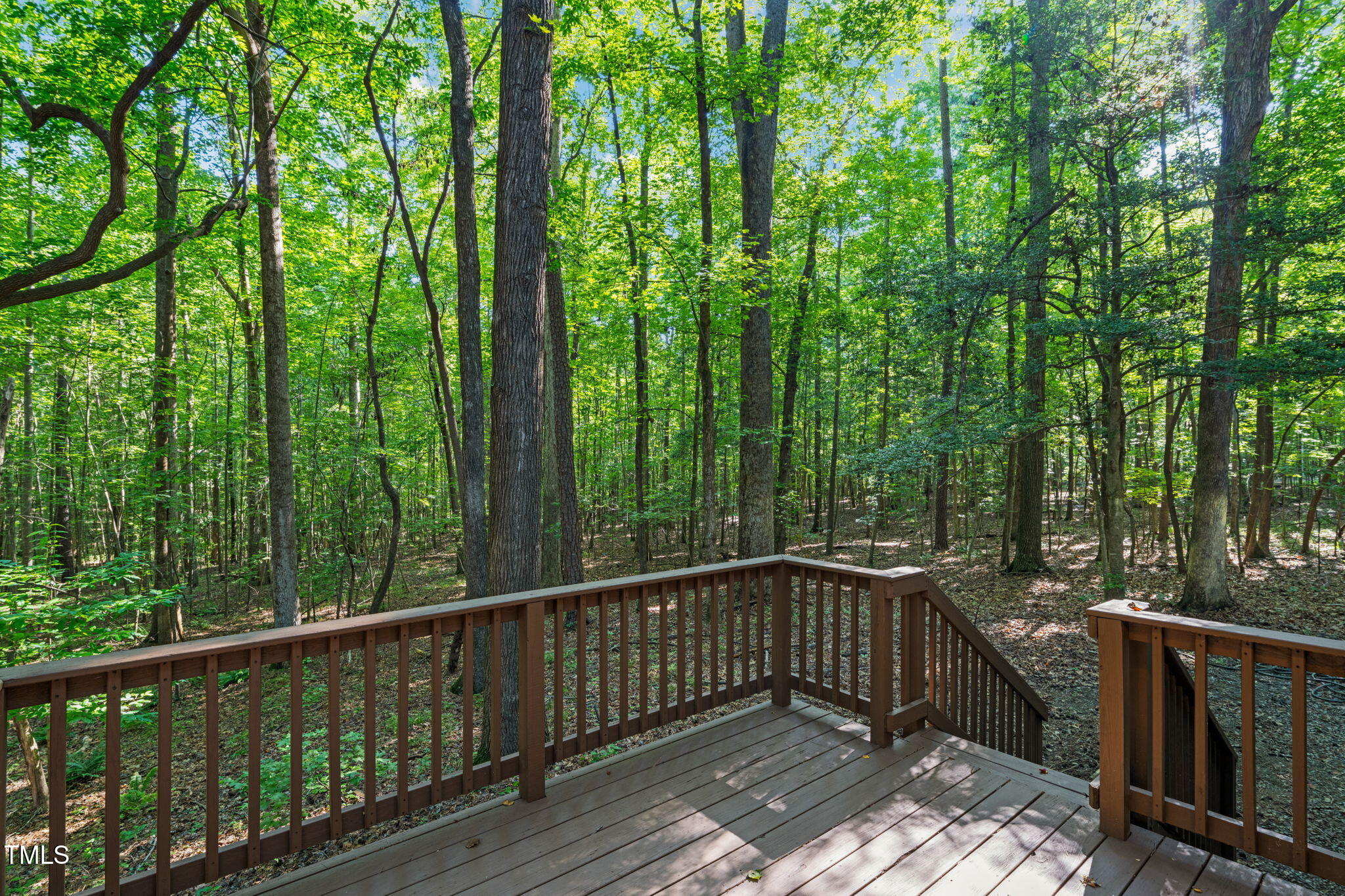 5500 Bobbitt Road Apex, NC 27539 - Photo 18 of 23 a view of balcony with deck and trees