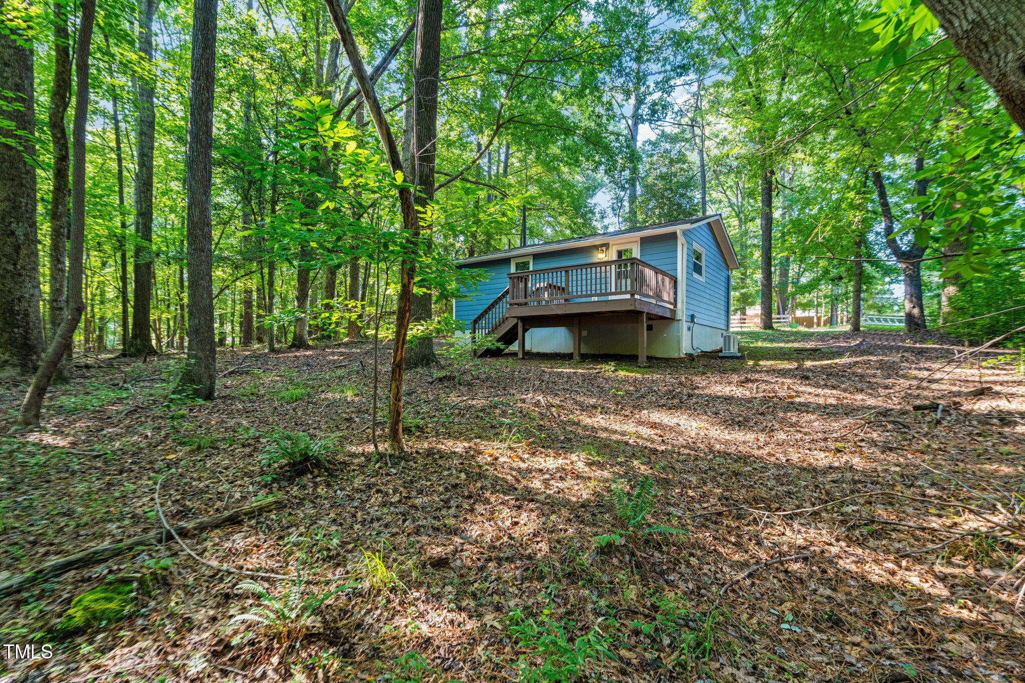 5500 Bobbitt Road Apex, NC 27539 - Photo 21 of 23 a backyard of a house with table and chairs