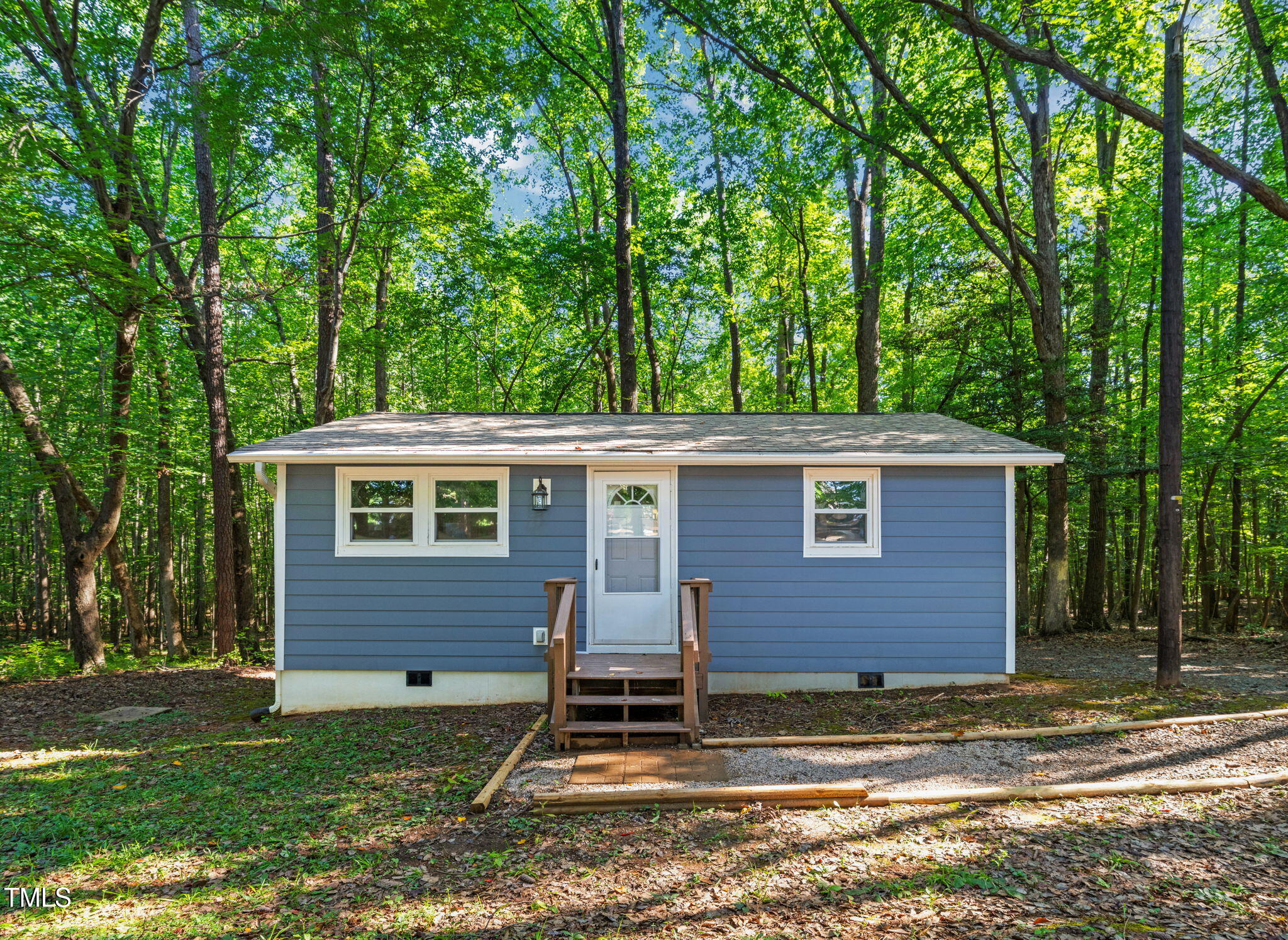 5500 Bobbitt Road Apex, NC 27539 - Photo 3 of 23 a front view of a house with a yard