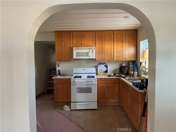 a kitchen with a stove and a refrigerator
