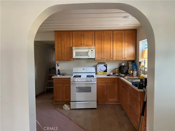 a kitchen with a stove and a refrigerator