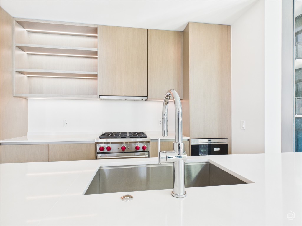 610 Davis Street, Unit 2808 Austin, TX 78701 - Photo 20 of 29 a kitchen with a refrigerator and a sink