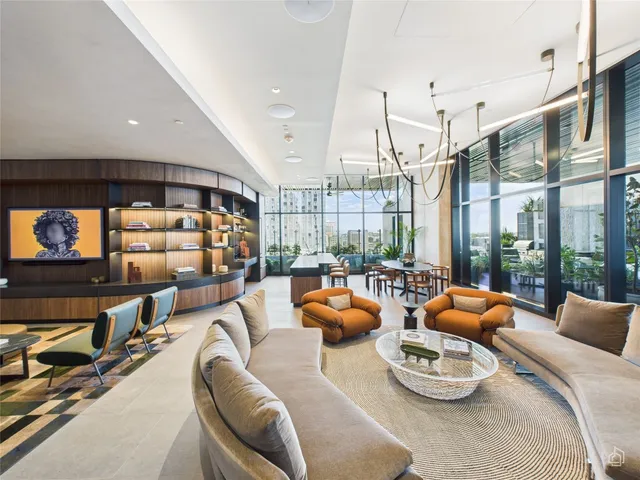 a room with furniture and a large window