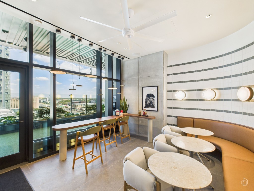 610 Davis Street, Unit 2808 Austin, TX 78701 - Photo 27 of 29 a living room with furniture and a large window