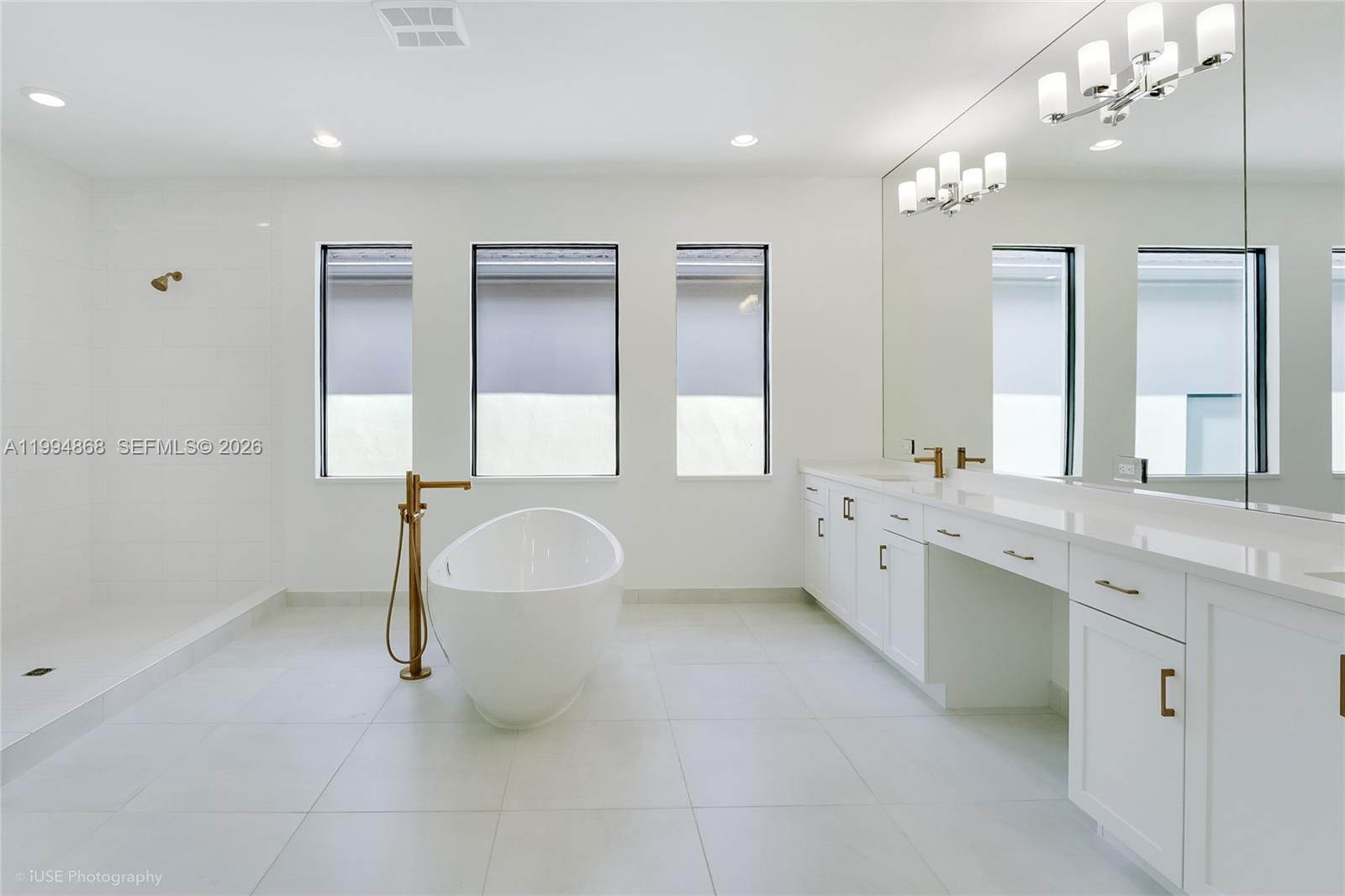 8095 Crystal Downs Avenue Boca Raton, FL 33434 - Photo 15 of 26 a bathroom with a double vanity sink mirror and double