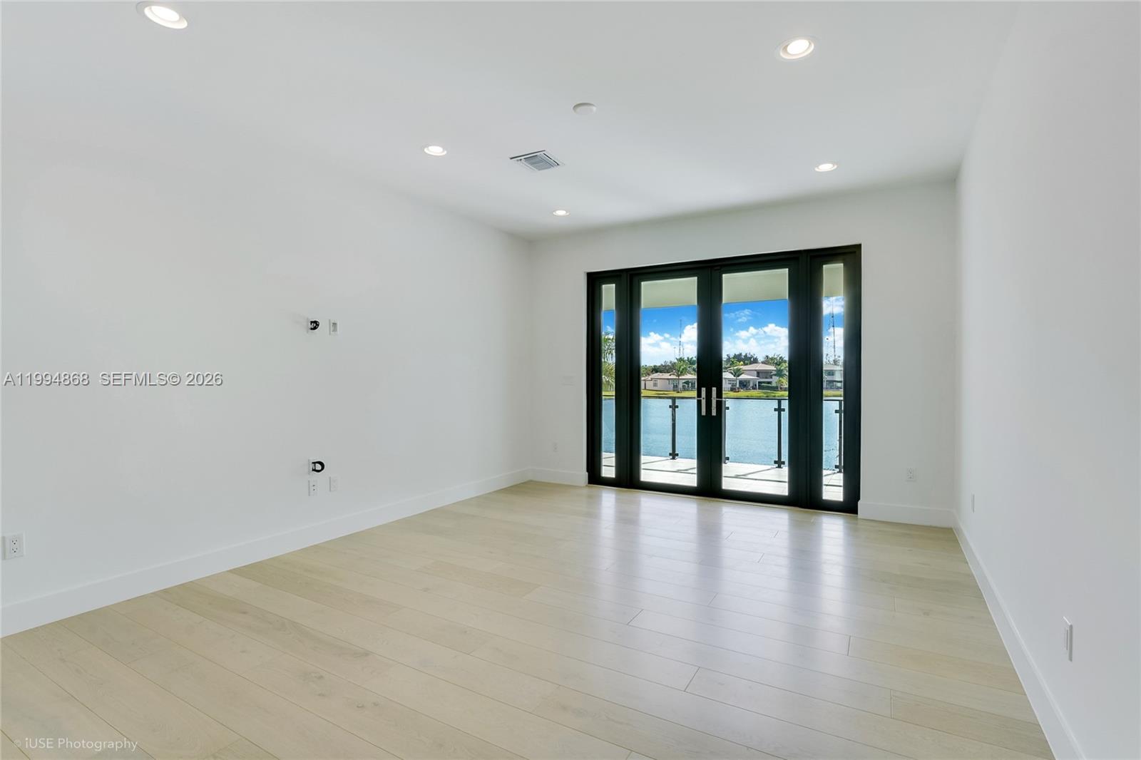 8095 Crystal Downs Avenue Boca Raton, FL 33434 - Photo 19 of 26 wooden floor in an empty room with a window