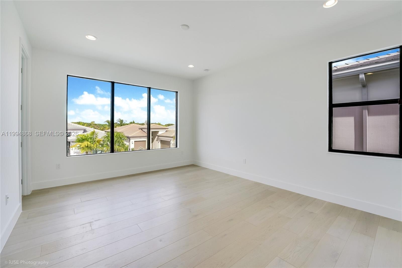 8095 Crystal Downs Avenue Boca Raton, FL 33434 - Photo 20 of 26 an empty room with windows and air conditioner