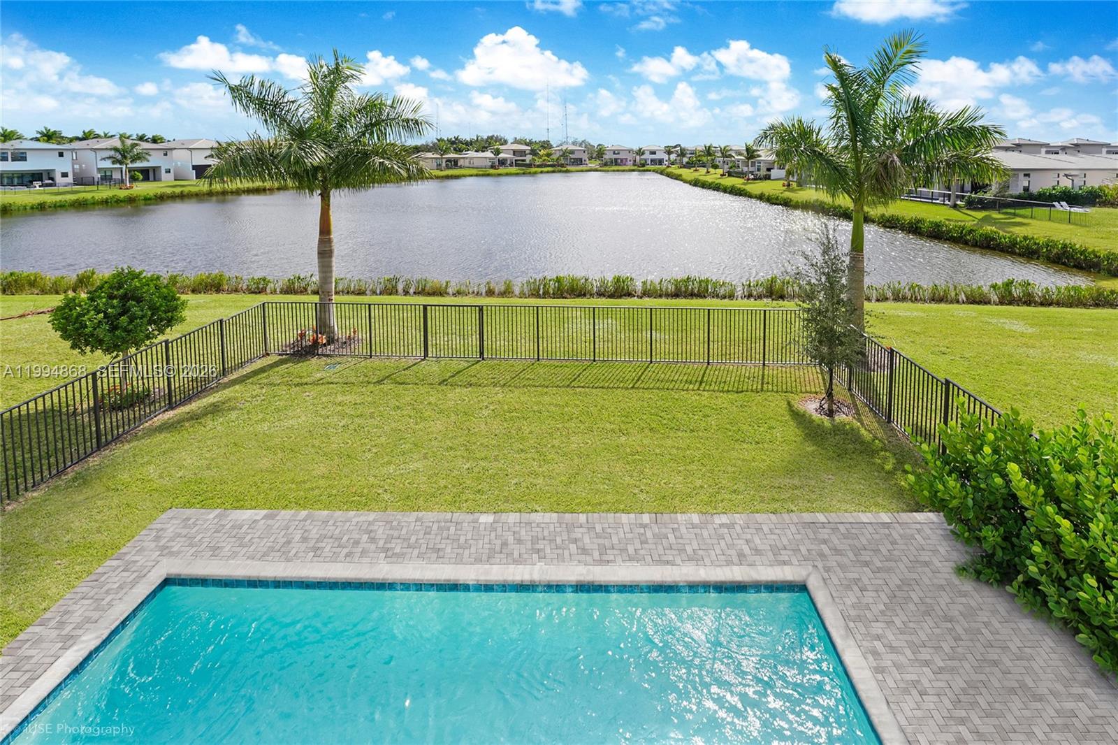 8095 Crystal Downs Avenue Boca Raton, FL 33434 - Photo 24 of 26 a view of a lake with houses in the back