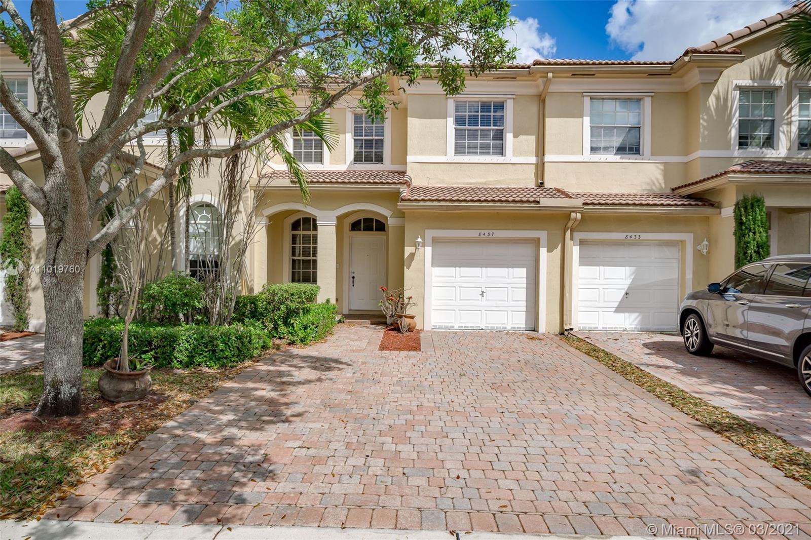 8437 Southwest 29th Street, Unit 102 Miramar, FL 33025 - Photo 1 of 29 a view of a car parked in front of a house