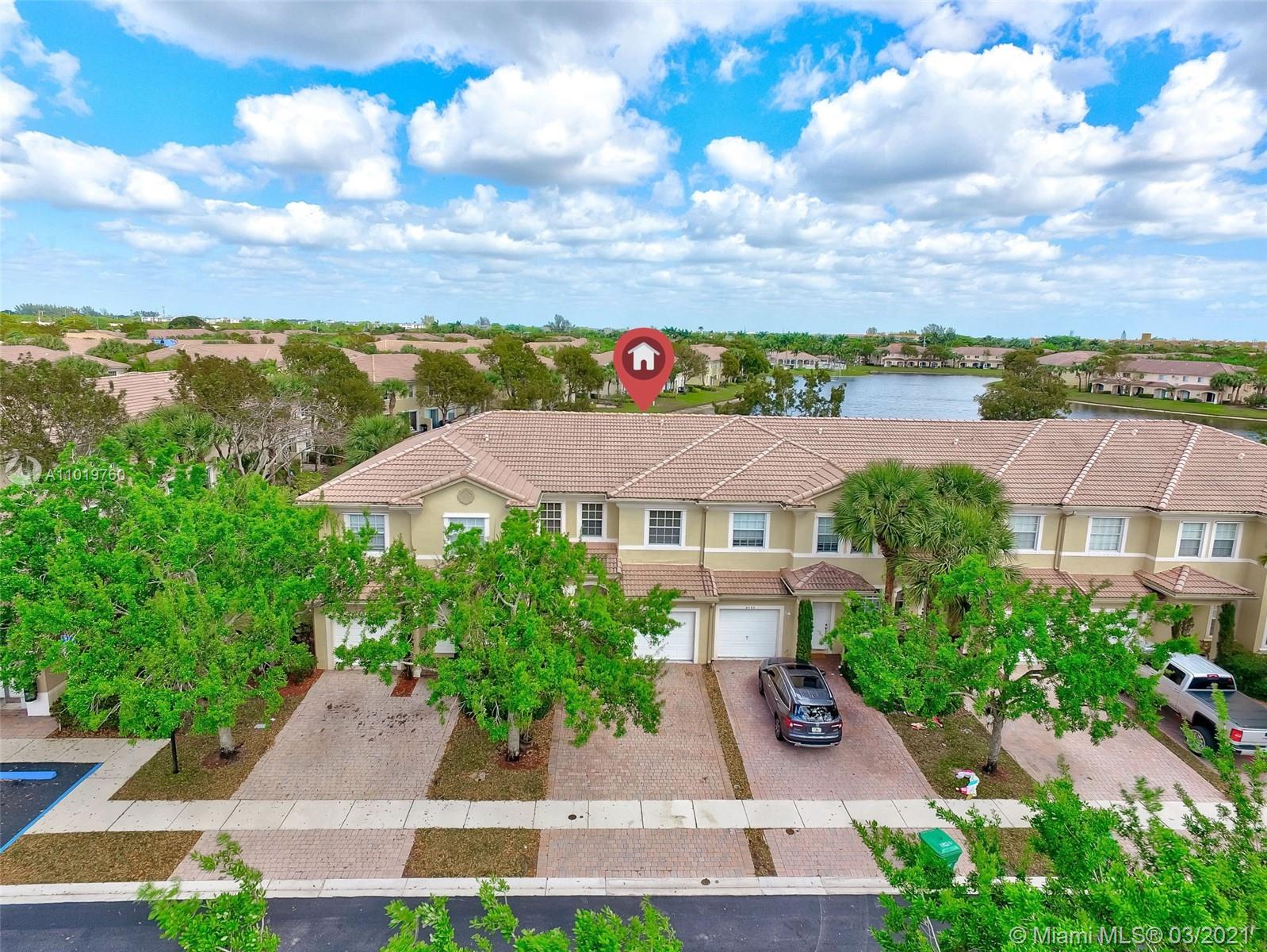 8437 Southwest 29th Street, Unit 102 Miramar, FL 33025 - Photo 2 of 29 an aerial view of house with yard